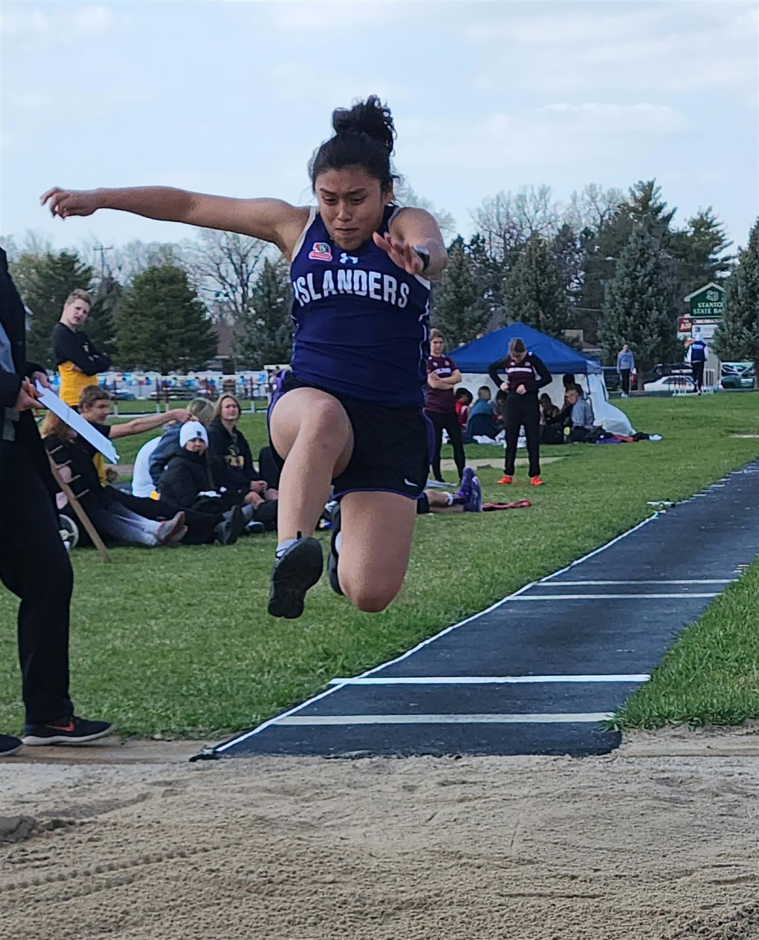 Sara Lopez competing in the GISH Unified Track long jump.